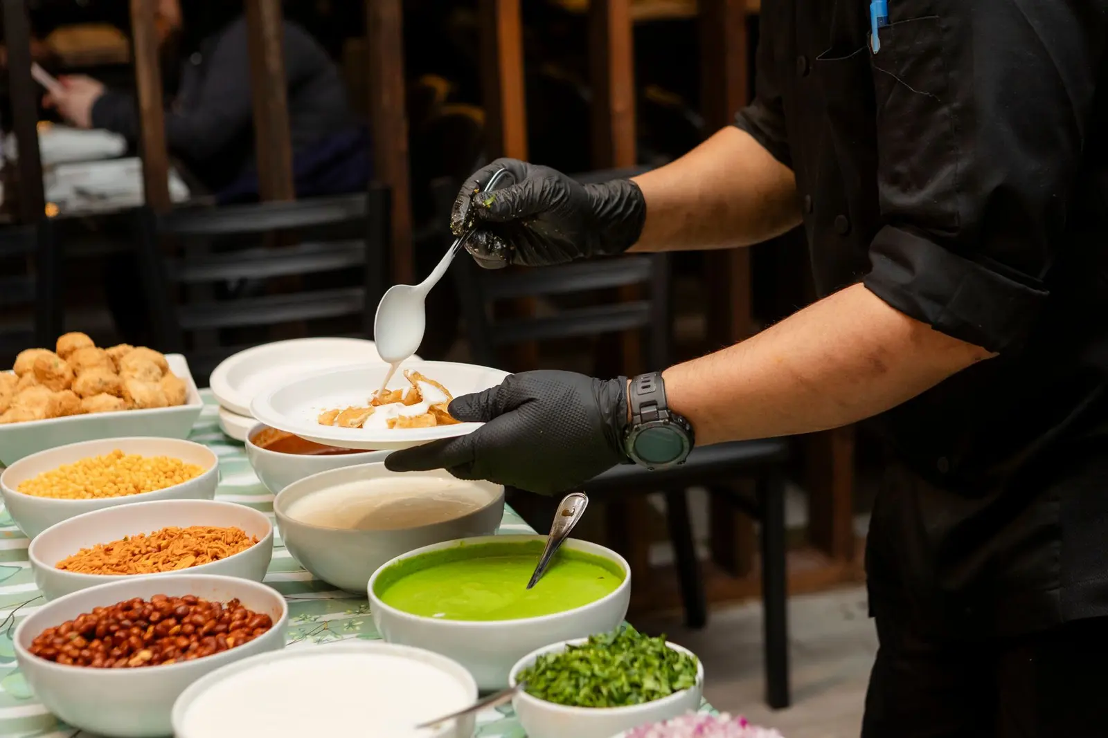 Chefs working the pass in a professional restaurant kitchen